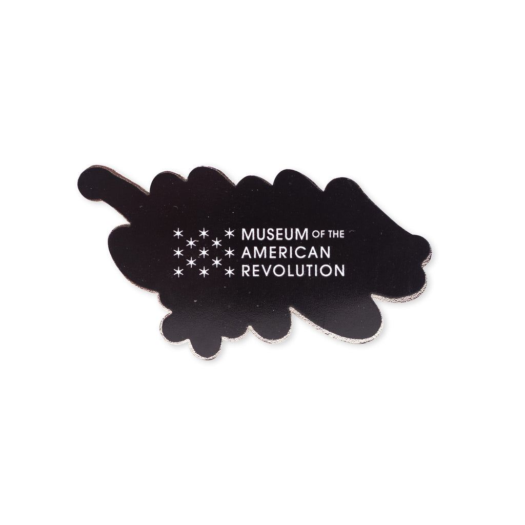 The 1776 Magnet is a black cloud-shaped magnet featuring white stars and "Museum of the American Revolution" text—a stylish tribute to American independence.