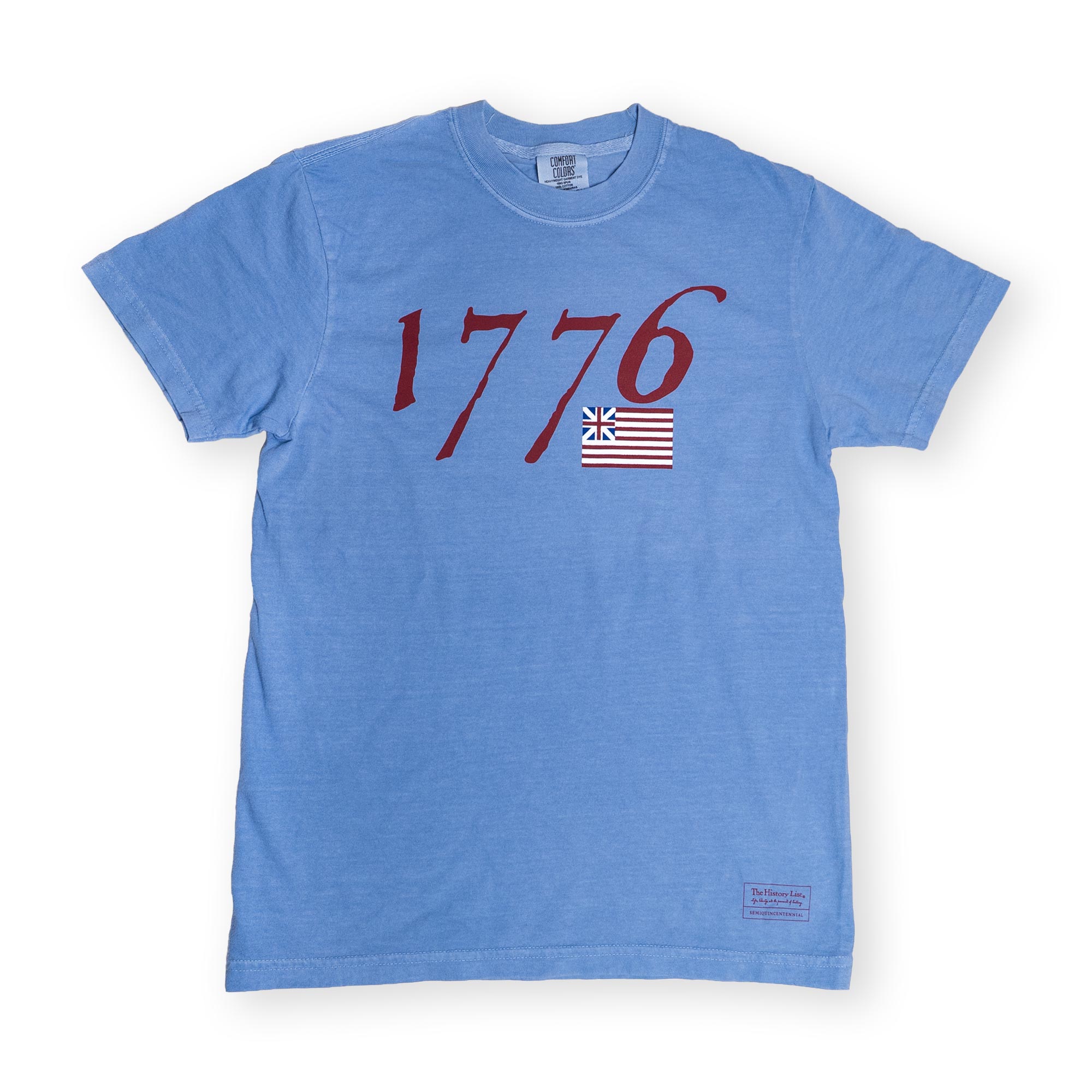 Show your love for American history with the We Hold These Truths 1776 T-Shirt in washed denim, featuring “1776” in bold red font and an early American flag graphic centered on the chest—a classic choice for celebrating July 4th or embracing timeless patriotic style.