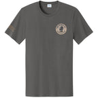 March on Washington T-Shirt in gray with a small beige circular logo — peace sign and "1963 March on Washington" — on the left chest, plus a beige inscription on the left sleeve.