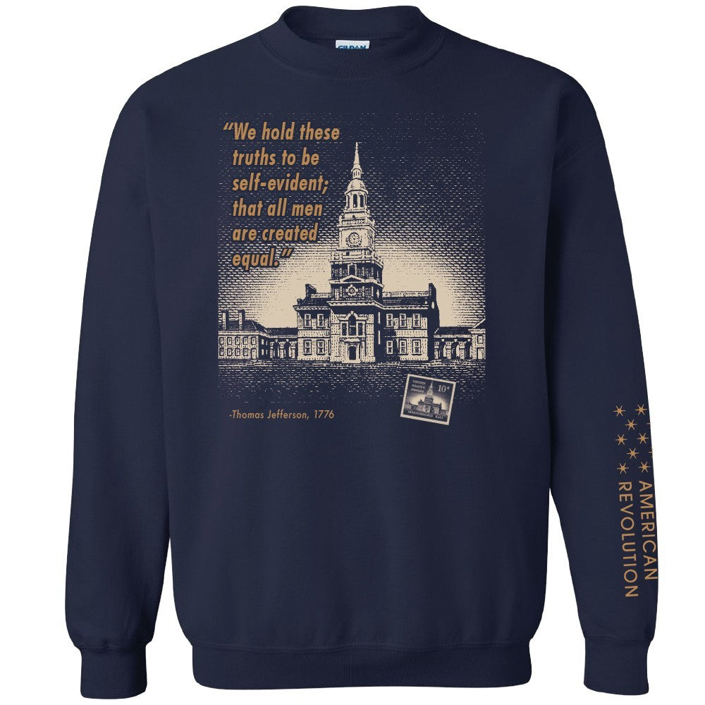 The Thomas Jefferson Sweatshirt in navy blue features a sketch of Independence Hall, an equality quote, a vintage photo, and "AMERICAN REVOLUTION" with stars on the sleeve.