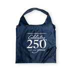 The Celebrating 250 Packable Tote Bag in navy features white "Museum of the American Revolution Celebrating 250 years 1776–2026" text, a built-in handle, and attached drawstring pouch—perfect for everyday use.