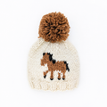 Off-white Knit Horse Beanie for Baby & Kids featuring a brown and black horse design and a large brown yarn pom-pom on top.