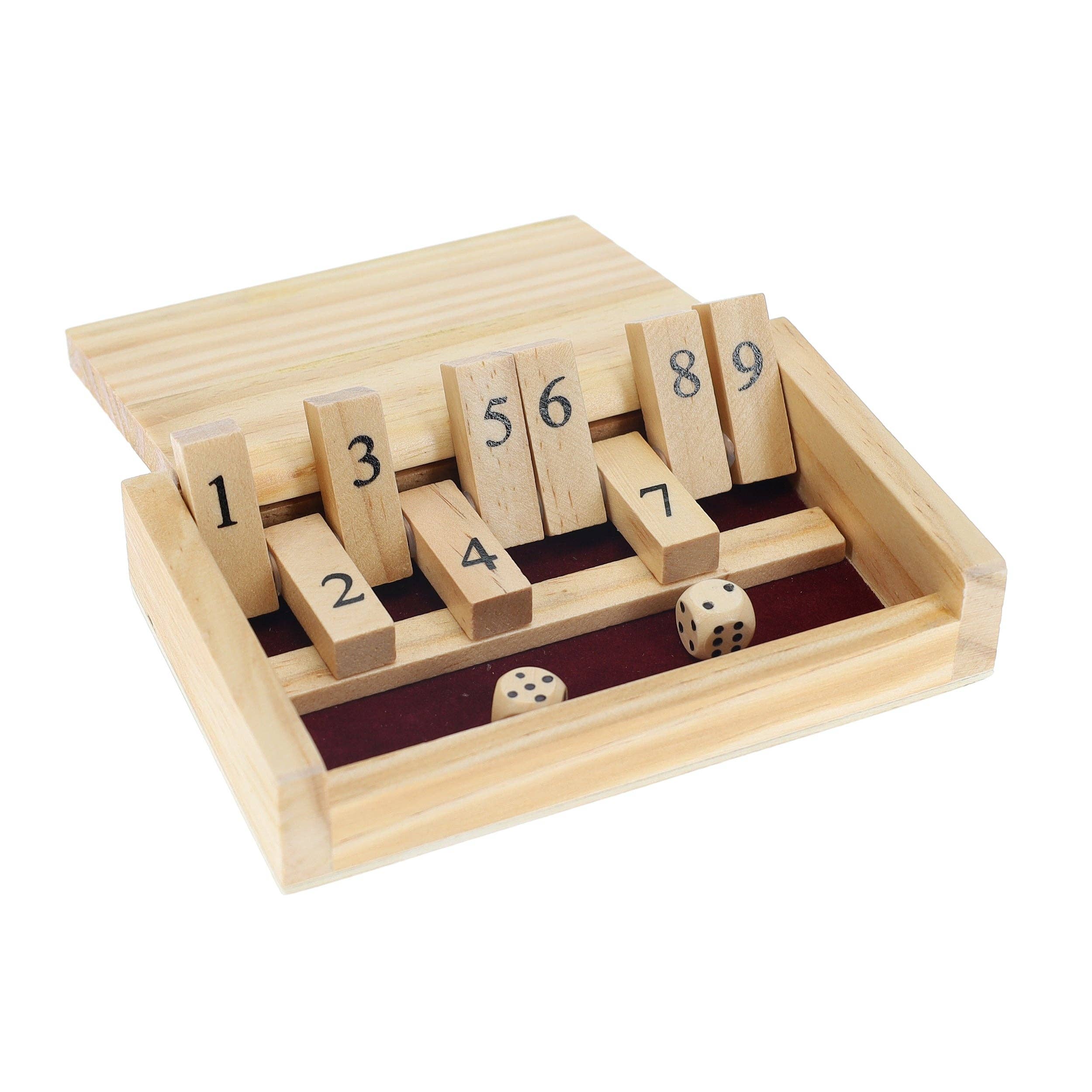 The Mini 9 Number Shut The Box Game is a travel-sized wooden dice game featuring upright numbered tiles from 1 to 9 and two six-sided dice showing a five and a six, all neatly contained in a rectangular wooden box with a sliding lid.