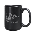 The Join or Die Mug is a black ceramic mug with a white segmented snake illustration and iconic text, inspired by Benjamin Franklin’s American Revolution design.