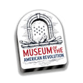 Museum Magnet, Wood features an illustrated design with cannons, stars, and an arched motif above “Museum of the American Revolution” in bold red and blue.