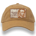 The Abraham Lincoln Cap features a tan design with Lincoln's image and the quote: "A NEW NATION, CONCEIVED IN LIBERTY — Abraham Lincoln, 1863." 