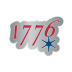 The 1776 Magnet features "1776" in bold red with a blue starburst. A white outline and gray background complete this eye-catching design.