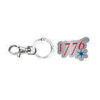 The 1776 Keychain features a lobster clasp, circular key ring, and a charm with "1776" in red numbers and a blue star under the last digit.
