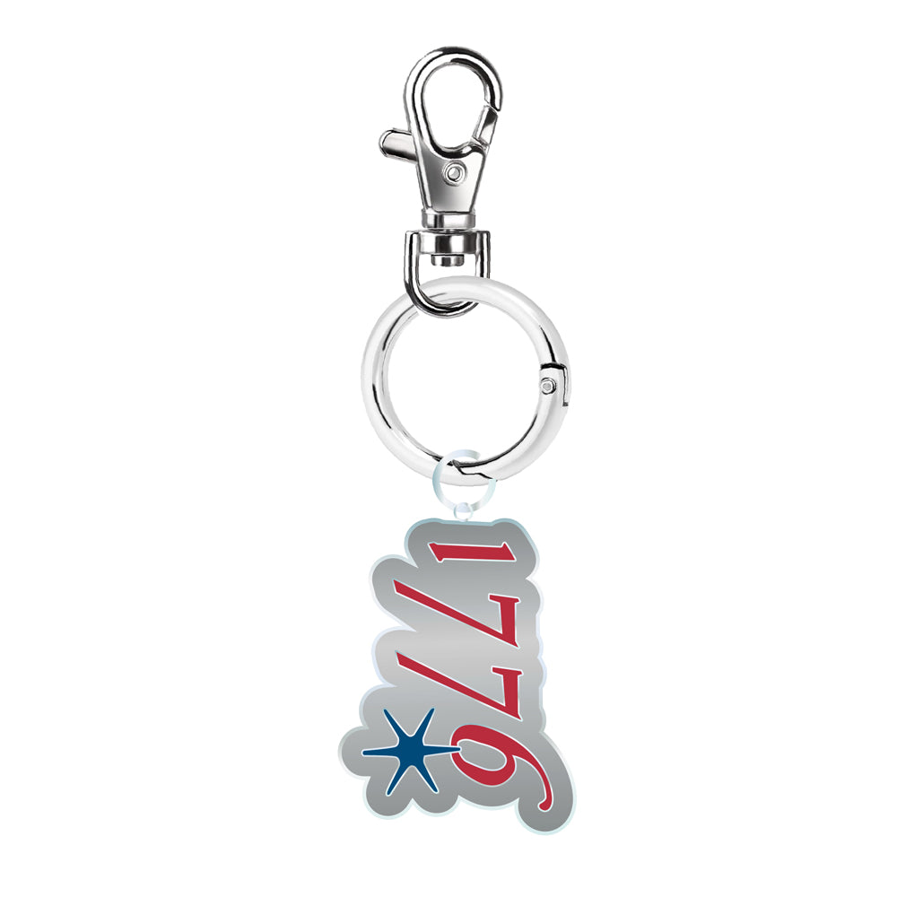 The 1776 Keychain is a silver commemorative accessory with a pendant displaying "1776" in red and white script, accented by a blue starburst.