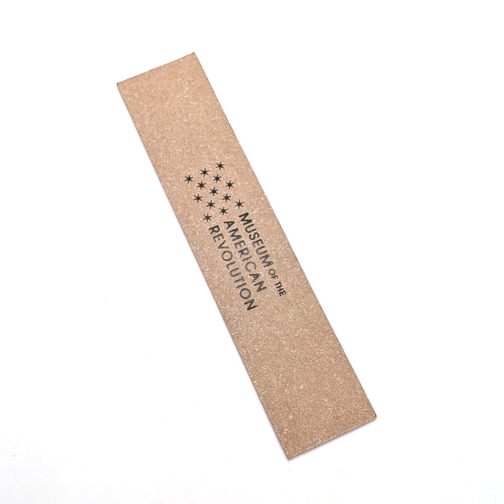 The Thomas Jefferson Quote Bookmark is a rectangular, tan accessory featuring "Museum of the American Revolution" and thirteen stars in a circle, inspired by founding principles and the Declaration of Independence.
