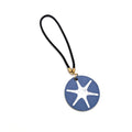 The Star Bag Charm is a round blue keychain with a white 6-sided star inspired by the George Washington star, featuring a black looped strap and small gold ring.