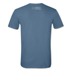 The Well-Behaved Women T-Shirt is a blue short-sleeve tee shown from the back, featuring a small white Museum of the American Revolution logo with a star design near the neckline.