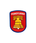 The Pennsylvania Embroidered Patch showcases a blue border and red background, with “PENNSYLVANIA” displayed at the top and a yellow Liberty Bell at the center. This vibrant patch is a colorful tribute to Pennsylvania’s rich history and iconic imagery.