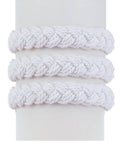 Three White Sailor Knot Bracelets with thick, braided designs are displayed on a cylindrical stand, evoking timeless maritime heritage.