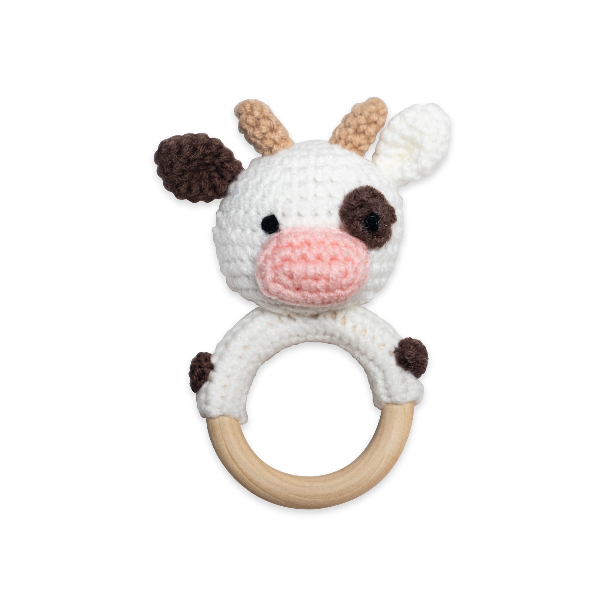 The Hand Crochet Rattle features an organic cotton cow head in brown and white, attached to a smooth wooden teething ring, all displayed against a white background.