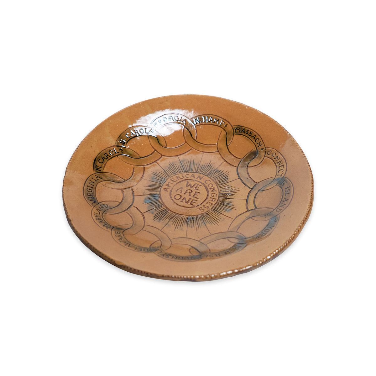The Chain of States Plate, Yellow, showcases interlocking chain links inscribed with U.S. state names encircling the phrase “AMERICAN UNION, WE ARE ONE” at its center—an iconic piece from the Chain of States collection, perfect for patriotic home décor.