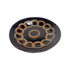 The Chain of States Plate, Black is a handcrafted ceramic plate with interlocking gold rings and engraved text along the rim, featuring “We Are One” in the center.