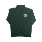 The Chain of States Quarter Zip Sweatshirt is a dark green quarter-zip with a zipper at the collar. A white sunburst design with the words WE ARE ONE appears on the left chest, reflecting themes of American unity and colonial history. Laid flat on a white background, this standout piece is ideal for anyone interested in historic-inspired apparel.