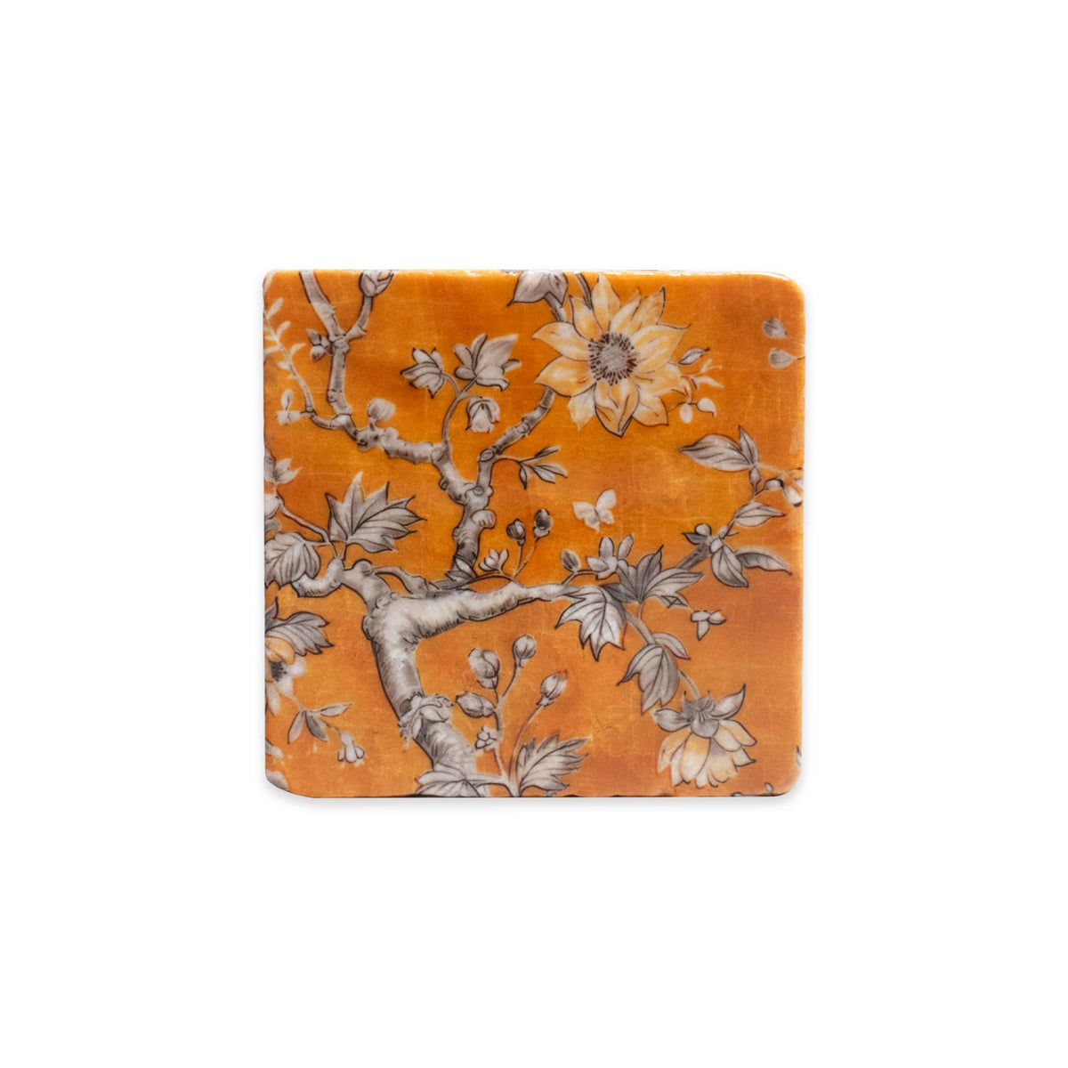Golden Tapestry square tumbled marble coaster with an orange background and a black and white illustration of a flowering tree.