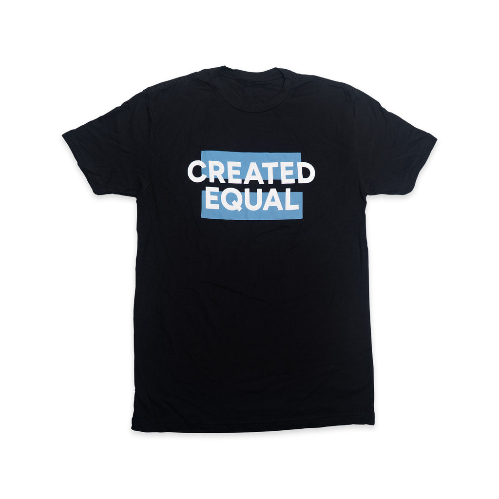 Created Equal T-Shirt displayed flat on a white background, featuring the phrase “CREATED EQUAL” in bold white letters partially overlaying a blue rectangle. This patriotic shirt is a subtle tribute to American history, making it an ideal Declaration of Independence-themed tee for anyone who values equality and freedom.
