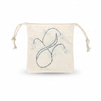 The Embroidery Kit includes a small off-white drawstring pouch with a light blue hand-stitched floral and leaf design on the front, plus two knotted drawstrings—ideal for showcasing beginner embroidery skills.