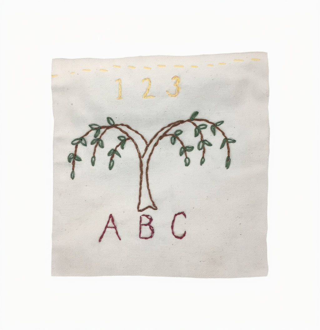 The Embroidery Kit features a square fabric with hand-stitched tree, 1 2 3 above, and A B C below—ideal for beginners or anyone interested in exploring hand-stitched designs.