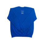 The James Forten Crewneck Sweatshirt is shown from the back in royal blue, featuring a small white graphic with thirteen stars in a circle above the text "AMERICAN REVOLUTION" on the upper center near the collar—a subtle tribute to trailblazers like James Forten, an African American entrepreneur whose sailmaking business flourished during this historic era.