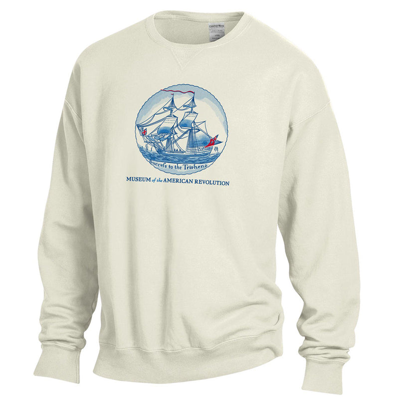 The "Success to Triphena" Sweatshirt is an off-white crewneck featuring a blue and red colonial sailing ship inside a circle, with "Sweet to the Thirsty" and "Museum of the American Revolution" below the image. 