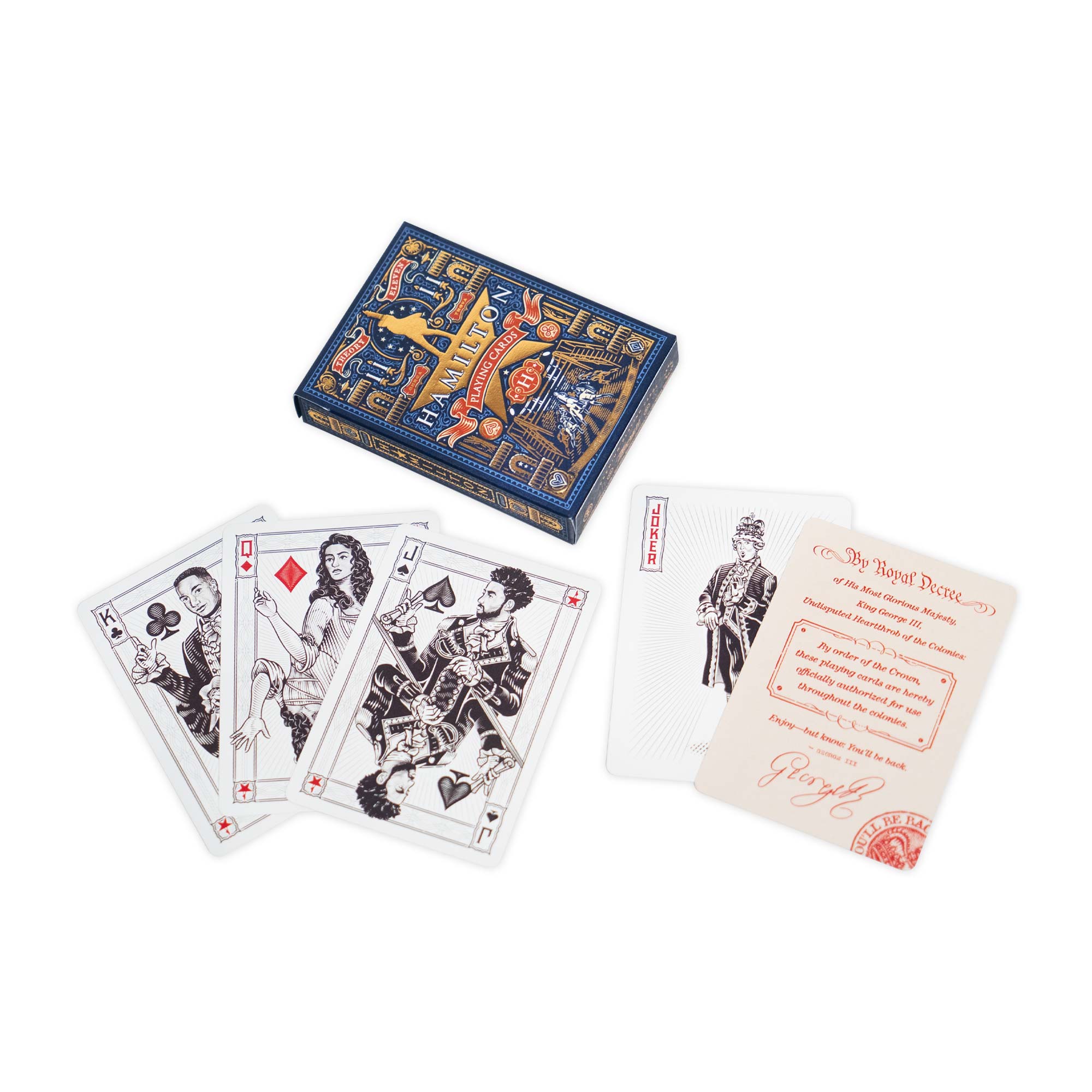 The Hamilton Playing Cards are displayed in an elegant decorative box alongside four face cards—Jack of Clubs, Queen of Diamonds, King of Spades, Ace of Hearts—and an informational card with red text, all arranged on a white surface. This premium set is inspired by the iconic Hamilton playing cards collection, making it a standout piece for Broadway musical fans and collectors.