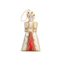 Introducing the Martha Washington Ornament—a decorative felt doll adorned in a white and red dress with gold trim, white gloves, and a gold string loop for hanging. This charming ornament makes a perfect historical decoration or unique addition to your collection.