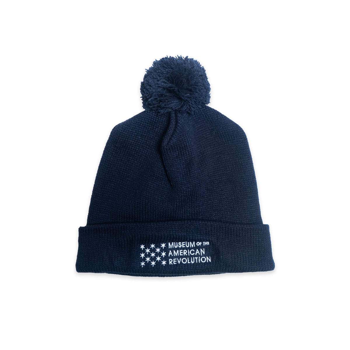 Museum Beanie in navy blue knit with a white embroidered Museum of the American Revolution logo featuring thirteen stars on the folded cuff.