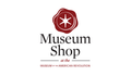 Logo for the Museum Shop Gift Card at the Museum of the American Revolution, showing a red wax seal with a white star above "Museum Shop" in black and red text on a white background.