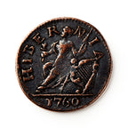 A worn 1760 Voce Populi Farthing, a copper coin from colonial America, displays a seated female figure with a harp, “HIBERNIA” above, and “1760” below—an artifact of pre-Revolutionary commerce.