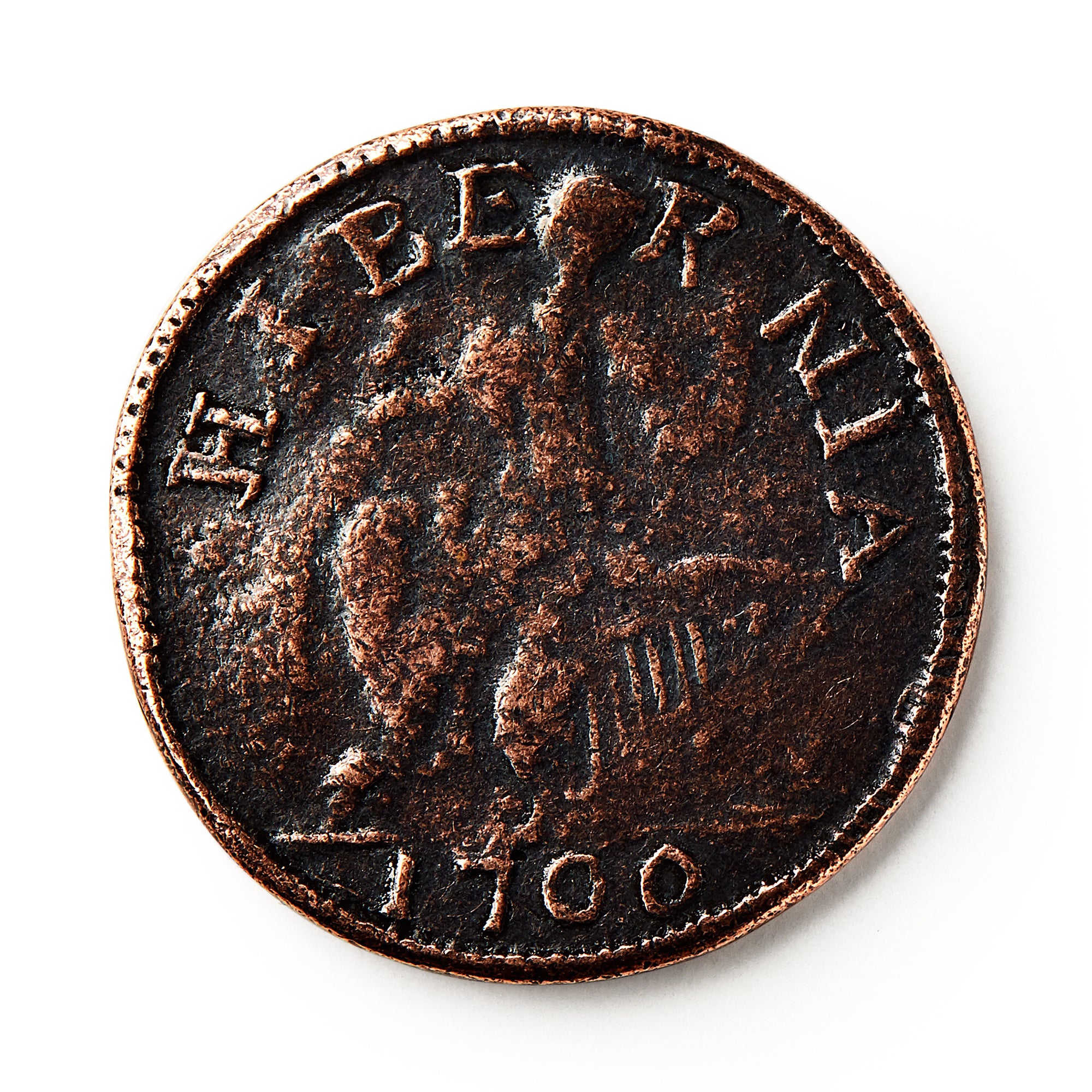 A worn 1760 Voce Populi Halfpenny features HIBERNIA at the top, with a faint central figure. Though wear obscures details, this colonial-era copper coin remains a prized historic collectible.