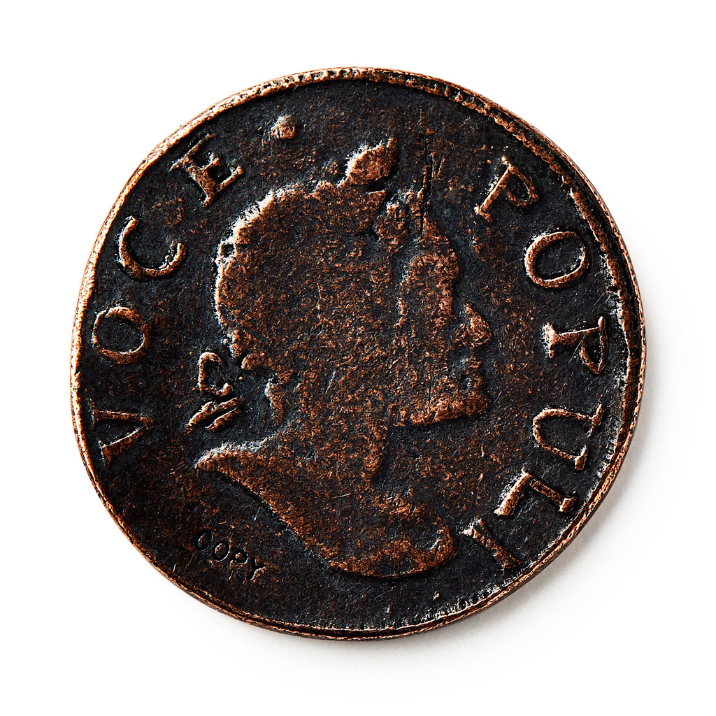 A close-up of the 1760 Voce Populi Halfpenny, a colonial token with a right-facing profile and "VOCE POPULI" inscribed around the edge. The coin features a dark patina and textured surface.