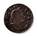 A close-up of the 1760 Voce Populi Halfpenny, a colonial token with a right-facing profile and "VOCE POPULI" inscribed around the edge. The coin features a dark patina and textured surface.