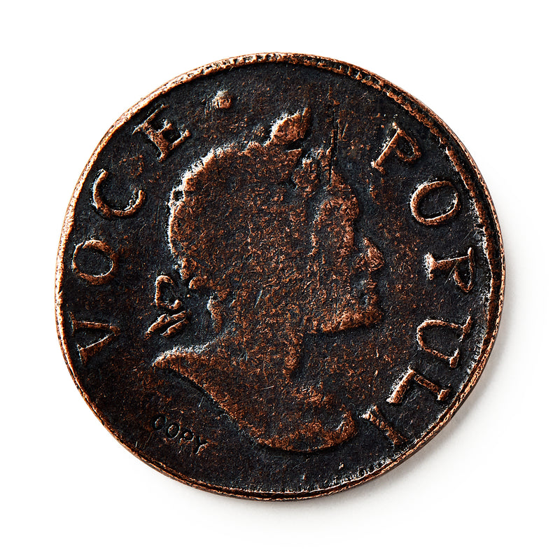 A close-up of the 1760 Voce Populi Halfpenny, a colonial token with a right-facing profile and "VOCE POPULI" inscribed around the edge. The coin features a dark patina and textured surface.