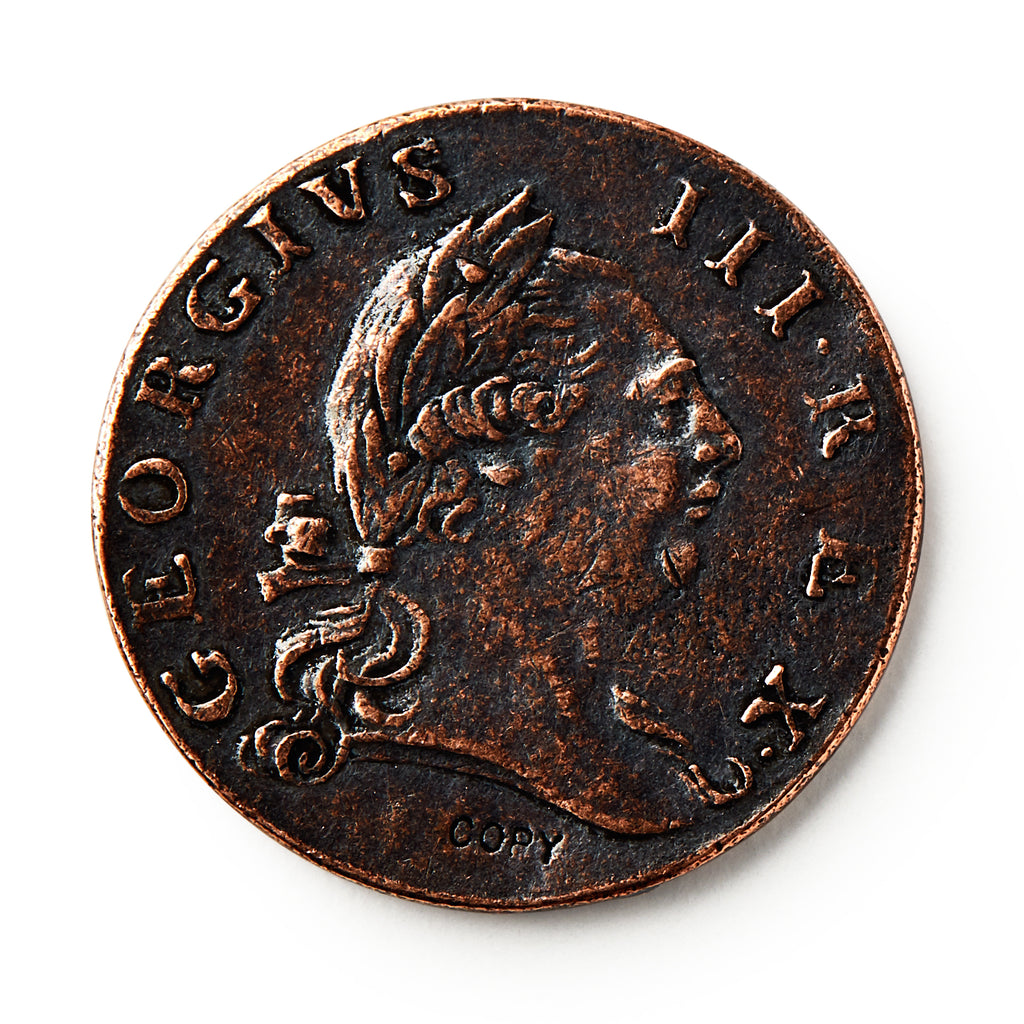 A close-up of a 1773 Virginia Halfpenny, an old British colonial coin showing a right-facing man with a laurel crown. The edge reads GEORGIUS III. REX, with COPY marked at the bottom of this historic currency.