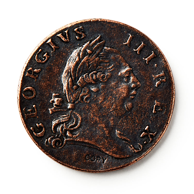 A close-up of a 1773 Virginia Halfpenny, an old British colonial coin showing a right-facing man with a laurel crown. The edge reads GEORGIUS III. REX, with COPY marked at the bottom of this historic currency.