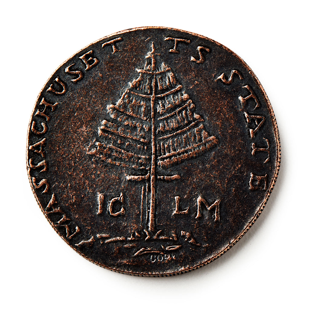 The 1776 Pine Tree Copper Coin features a detailed pine tree at its center, with MASSACHUSETTS and STATE inscribed along the edge—an iconic piece of early American currency representing colonial independence.