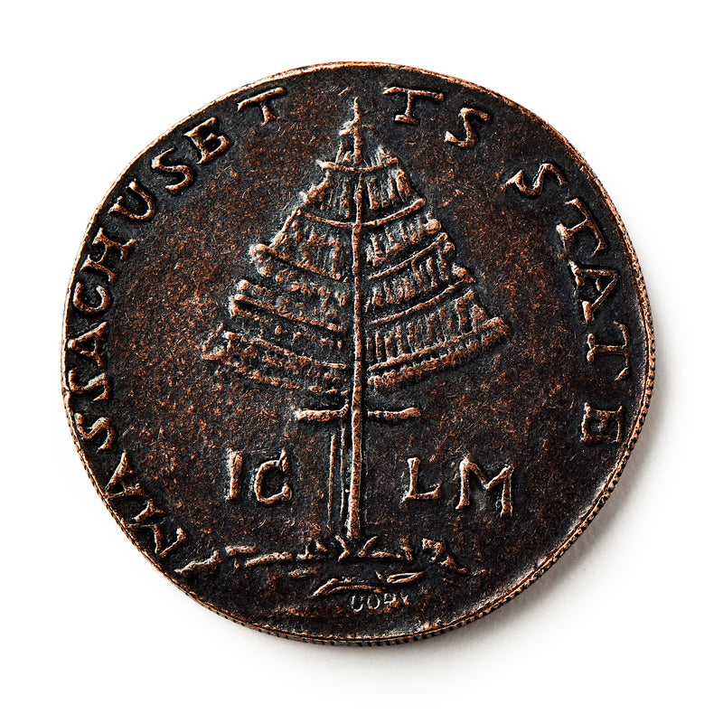 The 1776 Pine Tree Copper Coin features a detailed pine tree at its center, with MASSACHUSETTS and STATE inscribed along the edge—an iconic piece of early American currency representing colonial independence.