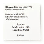 A white square card describes the 1776 New Hampshire Halfpenny replica: obverse shows a pine tree with 1776 split by the trunk; reverse reads AMERICAN LIBERTY and WM at center. Made in the USA from lead-free metal.