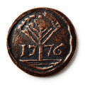 The 1776 New Hampshire Halfpenny features a raised tree design above the year 1776, reflecting early American independence, set against a crisp white background.