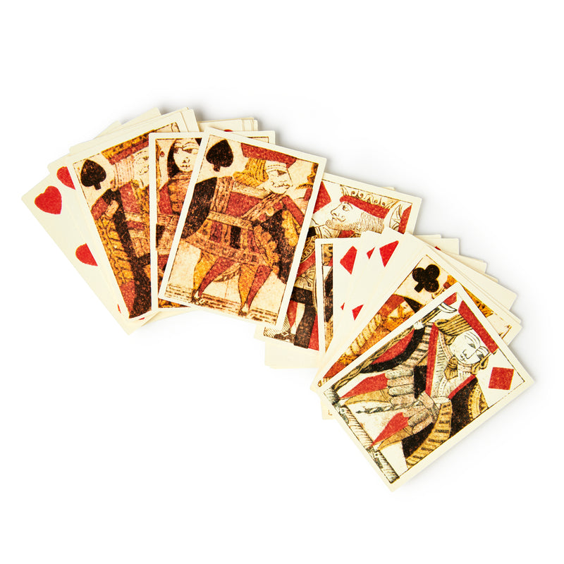 A scattered pile of 18th Century Playing Cards with traditional hearts, spades, diamonds, and clubs face designs is displayed on a white background.