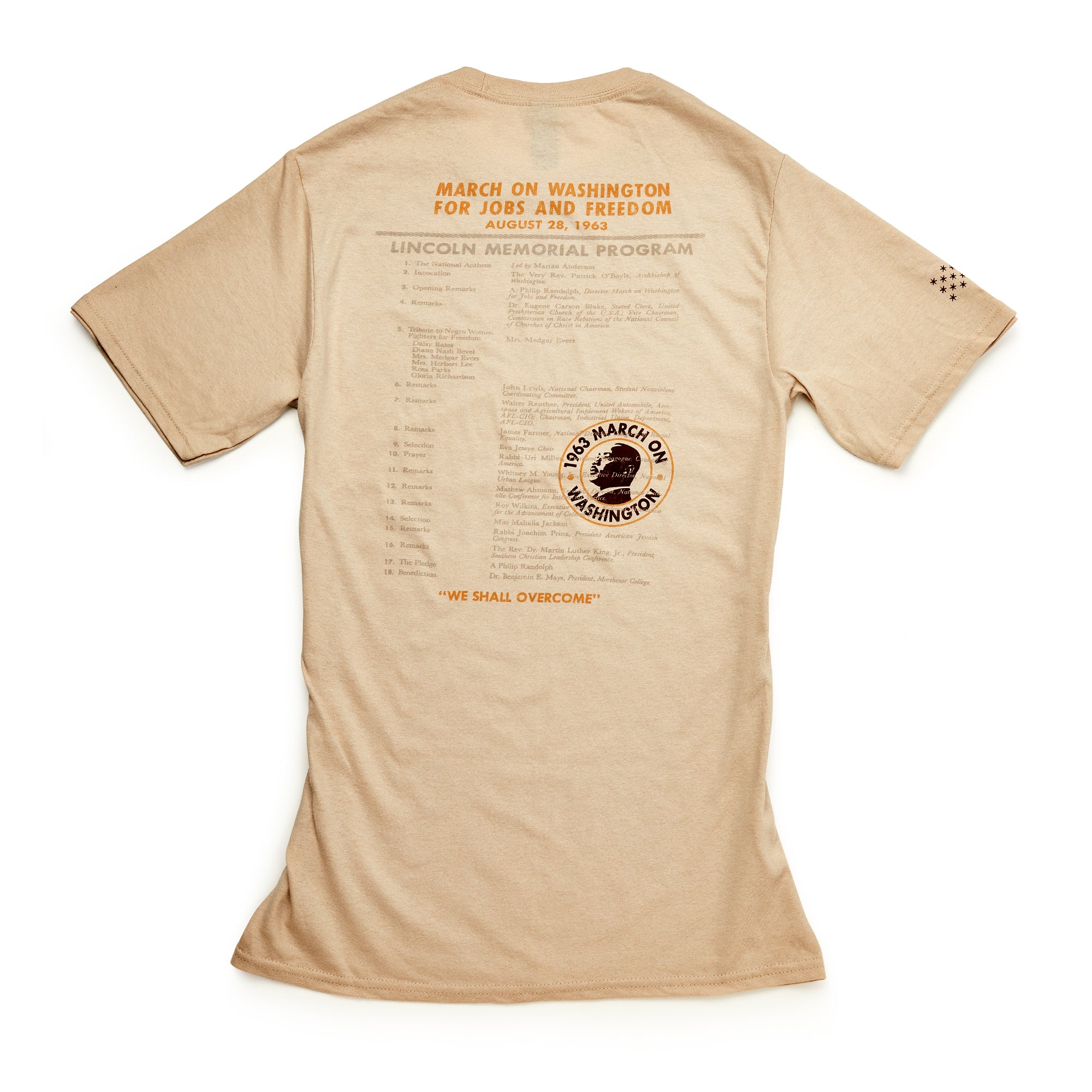 March on Washington T-Shirt, Natural—features orange and black text, civil rights details, a circular logo, "We Shall Overcome" phrase, and a program list honoring the historic march for equality.
