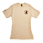 The March on Washington T-Shirt, Natural, features a small round "1963 March on Washington" civil rights logo and an image of Martin Luther King Jr. on the left chest, plus text near the right shoulder. Short sleeves and neutral beige color.