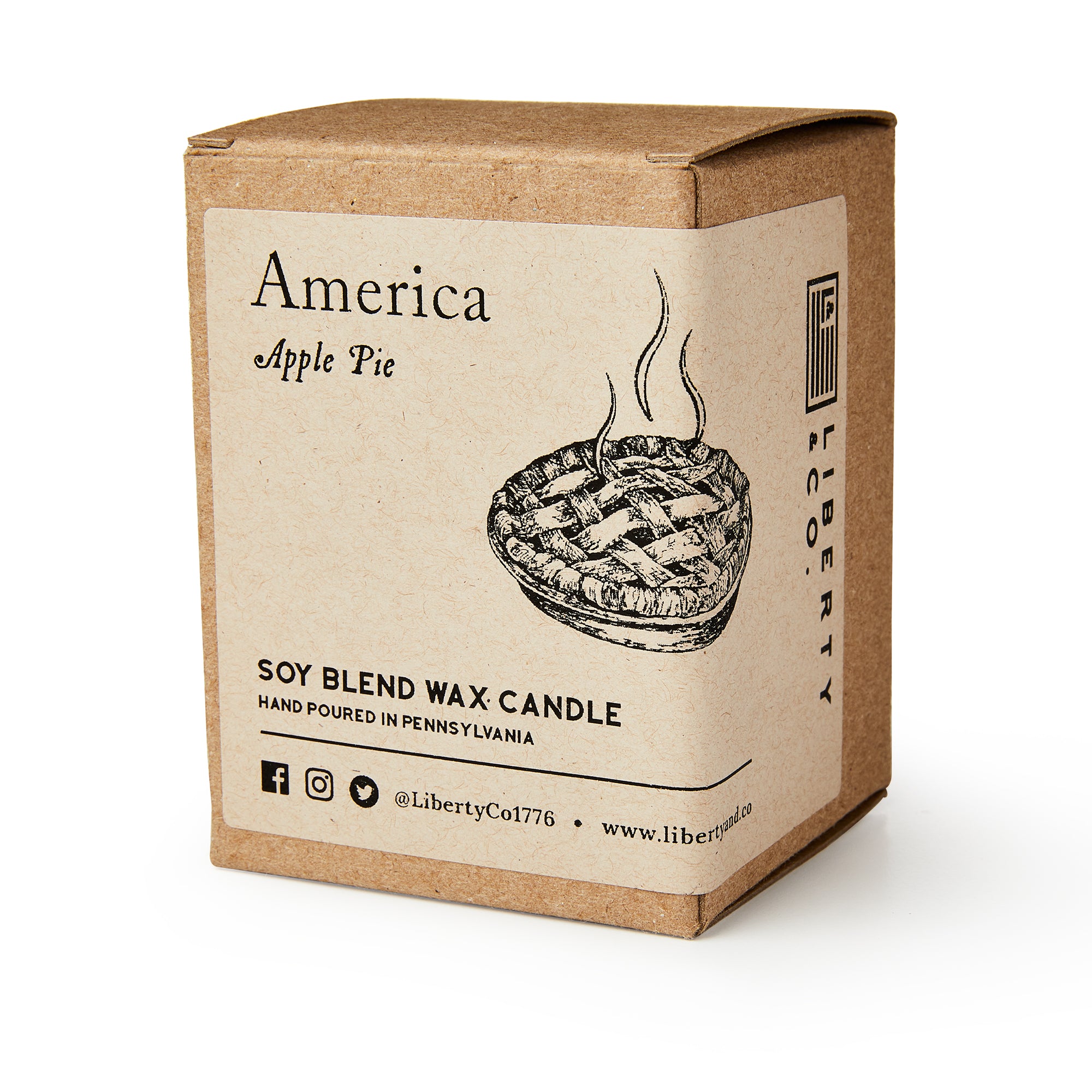 A brown cardboard box labeled America Candle holds a soy blend candle. The label shows a steaming apple pie and notes it's a hand-poured apple pie candle, perfect for making your home cozy.
