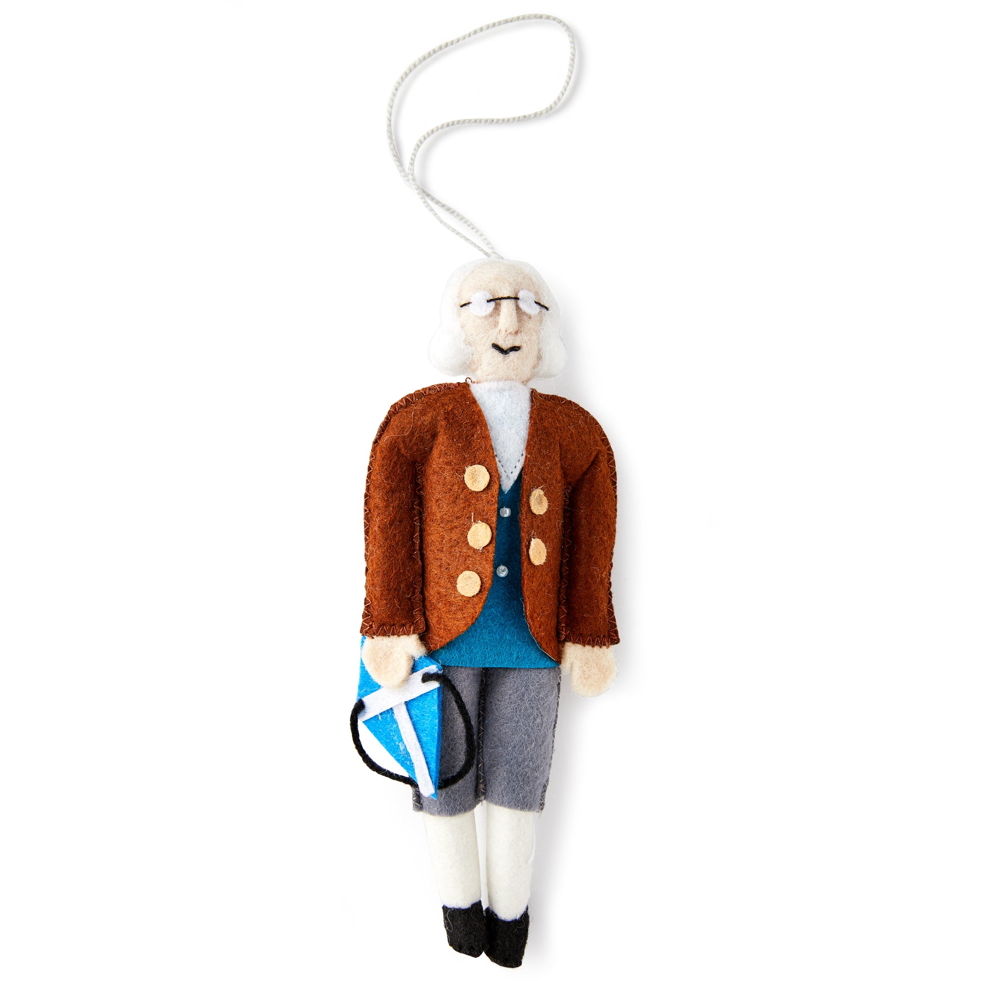 The Benjamin Franklin Ornament features his iconic white hair, glasses, brown coat, blue vest, and gray pants while holding a blue kite with a string.