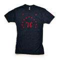 The Bennington 76 T-Shirt in dark gray features the number 76 in red, surrounded by thirteen red stars—a tribute to Revolutionary history—shown laid flat on a white background.