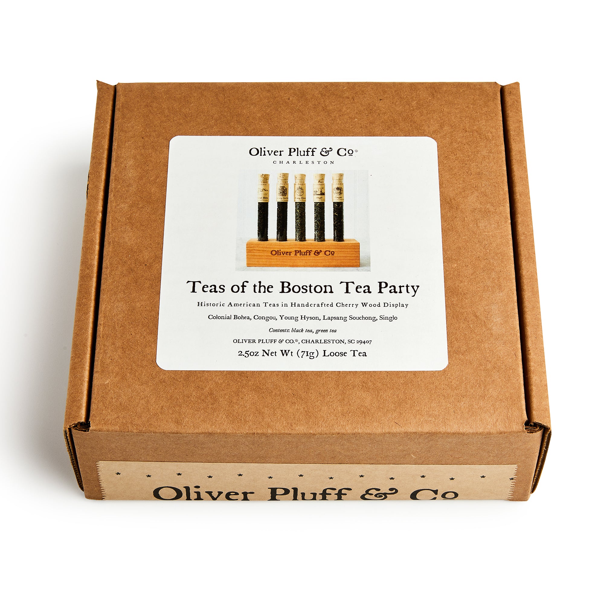 The Boston Tea Party Tea Sampler features five glass vials of premium teas in a brown box with historic American tea descriptions, crafted by Oliver Pluff & Co.